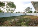 Spacious fenced backyard with ample room for outdoor activities and relaxation at 10740 Oldham Rd, Port Richey, FL 34668