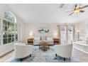 Spacious living room featuring lots of natural light, and a comfortable seating arrangement at 12229 Coldstream Ln, Tampa, FL 33626