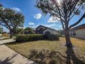 Inviting single-story home with lush landscaping and a convenient two-car garage at 1716 Bondurant Way, Brandon, FL 33511