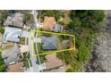 Aerial view showcasing the home's location, lot size, and proximity to neighboring properties at 1852 Longview Ln, Tarpon Springs, FL 34689