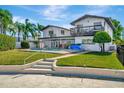 Expansive backyard featuring a pool, outdoor seating area, and a second-story balcony at 234 Palm Sw Is, Clearwater Beach, FL 33767