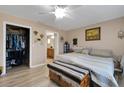 Spacious bedroom featuring a walk-in closet and ensuite bathroom for added convenience at 3147 Sydney Dover Rd, Dover, FL 33527