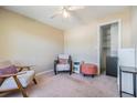 Cozy bedroom featuring a comfortable chair, ottoman, and closet space at 3320 Jackson N St, St Petersburg, FL 33704