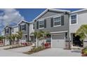 Charming townhomes feature two-car garages, stone accents and professional landscaping at 4444 Aqua Mirage St, Sarasota, FL 34238