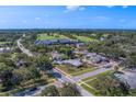 Suburban aerial view of the property near a golf course and country club amenities at 501 Poinsettia Rd, Belleair, FL 33756