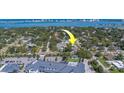 Aerial view of the neighborhood with the property indicated by a yellow arrow, close to the water at 501 Poinsettia Rd, Belleair, FL 33756