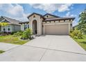 Beautiful exterior of one-story home with a well-maintained front yard and landscaping at 6227 Golden Nettle Dr, Apollo Beach, FL 33572