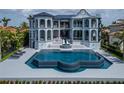 A stunning pool and patio area, ideal for outdoor relaxation and entertainment, complements the luxurious home at 6526 Surfside Blvd, Apollo Beach, FL 33572