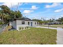 Cozy single-story house featuring a new driveway and a freshly landscaped front yard at 6816 S Hesperides St, Tampa, FL 33616