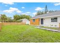 Attractive home with a spacious lawn, new fence, and charming walkway for easy access at 731 38Th N Ave, St Petersburg, FL 33704