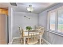 Cozy dining area with seating for four, perfect for intimate meals at 7564 Bayshore Dr # 202, Treasure Island, FL 33706