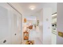 Hallway with closet leading to living room and kitchen areas of the home at 7823 Hardwick Dr # 224, New Port Richey, FL 34653