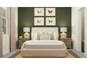 Cozy bedroom featuring a queen bed with neutral tones, complemented by butterfly artwork on the wall at 9779 Minnow Ray Dr, Land O Lakes, FL 34638