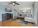 Inviting living room featuring wood floors, modern decor, and a comfortable seating area with a sofa at 101 Pompano Se Dr # C, St Petersburg, FL 33705