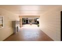 Entrance to a lush courtyard with a charming fountain and well-maintained brick pavers at 120 S Church Ave # 202, Tampa, FL 33609