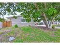 Single Gathering home's front yard showing the lush green grass at 12372 113Th St, Largo, FL 33778