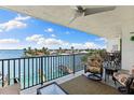Cozy balcony features comfortable seating with beautiful waterfront view at 12525 3Rd E St # 303, Treasure Island, FL 33706