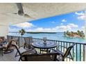 Outdoor balcony with seating and spectacular views of the water and natural landscape at 12525 3Rd E St # 303, Treasure Island, FL 33706