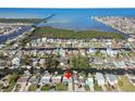 Aerial view of waterfront community highlighting waterfront access, residential properties, and lush landscapes at 13323 Susan Dr, Hudson, FL 34667