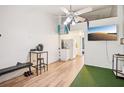 Bright living room featuring wood floors and a ceiling fan at 20921 Haulover Cv # 8, Lutz, FL 33558
