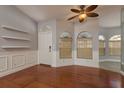 Bright foyer features hardwood floors, decorative molding, and large windows, creating a welcoming entrance at 22755 Cypress Trail Dr, Lutz, FL 33549