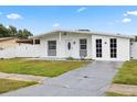 Inviting home with a lush green lawn and a well-maintained, classic facade at 2408 Wishing Well Way, Tampa, FL 33619