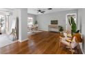 Bright living room featuring hardwood floors, modern decor, and ample natural light at 2432 Keene Park Dr, Largo, FL 33771