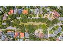 An aerial view of a neighborhood featuring manicured lawns and mature trees enhancing the curb appeal at 3144 W Waverly Park, Tampa, FL 33629