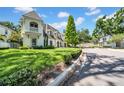 Charming two-story home with lush green lawn and manicured landscaping at 3144 W Waverly Park, Tampa, FL 33629