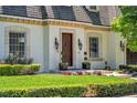 Elegant home featuring a dark wood front door and meticulously manicured landscaping at 3144 W Waverly Park, Tampa, FL 33629