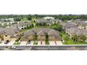 An aerial view of a meticulously maintained neighborhood with well-manicured lawns at 5153 Bay Isle Cir, Clearwater, FL 33760