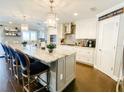 Spacious, updated kitchen featuring an expansive island, stainless steel appliances, and designer lighting at 5871 Oakhurst Dr, Seminole, FL 33772