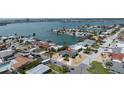 Beautiful aerial view showcases a waterfront property surrounded by lush greenery at 6405 2Nd Palm Pt, St Pete Beach, FL 33706