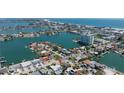 Stunning aerial view showcases a waterfront community near the ocean, with city views at 6405 2Nd Palm Pt, St Pete Beach, FL 33706