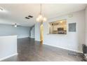 Open-concept living space flows into the kitchen and stairs, great for entertaining guests at 7410 E Bank Dr, Tampa, FL 33617