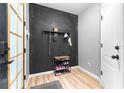 Entryway with stylish wall, shoe rack, and convenient coat hooks at 962 Sombra St, Tampa, FL 33619