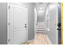 Hallway with staircase and neutral color scheme at 962 Sombra St, Tampa, FL 33619