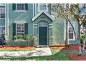 Charming front entrance with tasteful landscaping and well-lit walkway at 10412 White Lake Ct, Tampa, FL 33626