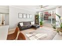 Stylish living room featuring a comfortable seating area and large windows at 10412 White Lake Ct, Tampa, FL 33626
