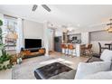 Bright living room open to the kitchen with modern finishes and ample natural light at 10412 White Lake Ct, Tampa, FL 33626