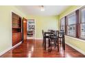 Charming dining room featuring hardwood floors, natural light, and a traditional dining table with chairs at 1511 East Emma St. E St, Tampa, FL 33610