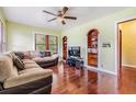 Inviting living room with ceiling fan, hardwood floors and large sectional sofa at 1511 East Emma St. E St, Tampa, FL 33610
