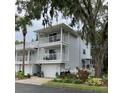 Charming two-story home with double balconies and well-maintained landscaping and mature tree at 2015 Vista Del Sol # 108, Lutz, FL 33558