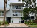 Well-maintained two-story home with double balconies, garage, and inviting curb appeal at 2015 Vista Del Sol # 108, Lutz, FL 33558