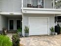 Townhouse exterior with a private garage and a well-maintained, paved driveway leading to the entrance at 2015 Vista Del Sol # 108, Lutz, FL 33558