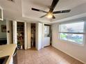 Bright area with pantry storage, stackable washer and dryer, and natural light at 3725 Teeside Dr, New Port Richey, FL 34655