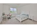 Serene bedroom with a large window, plush carpet, and neutral decor at 3816 N Maryland Ave, Plant City, FL 33565