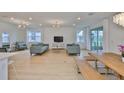 Open-concept living area with wood floors, recessed lighting, and ample natural light at 3816 N Maryland Ave, Plant City, FL 33565