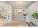 Entryway with large front door, closet, and french doors leading to living area at 475 Holly Hill Rd, Oldsmar, FL 34677