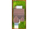 Aerial view of backyard showcasing a well-maintained lawn and privacy fence at 5016 Cypress Trace Dr, Tampa, FL 33624